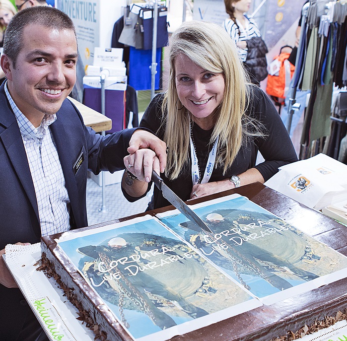 Cindy McNaull cutting cake. © Cordura